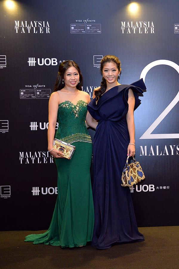 Lim May Shen in Innai Red and Lim May Jian in Chai Gold Label