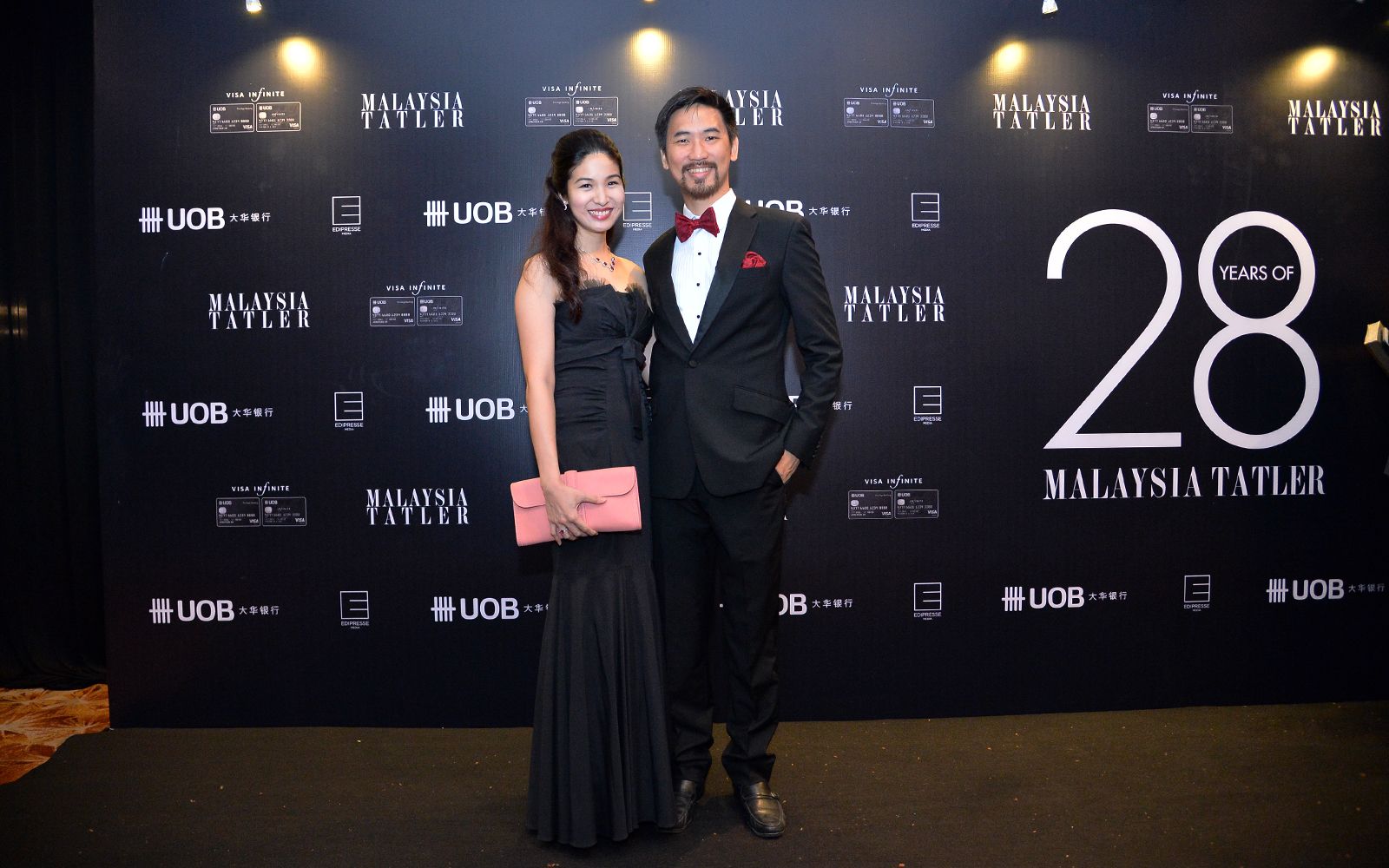 Melissa Lam in Neiman Marcus dress and Hermes bag and Daryl Foong