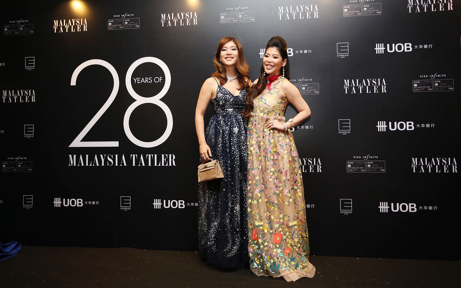 Shen-Tel Lee and Elizabeth Lee-Yong in Jonathan Liang and Bowerhaus accessories