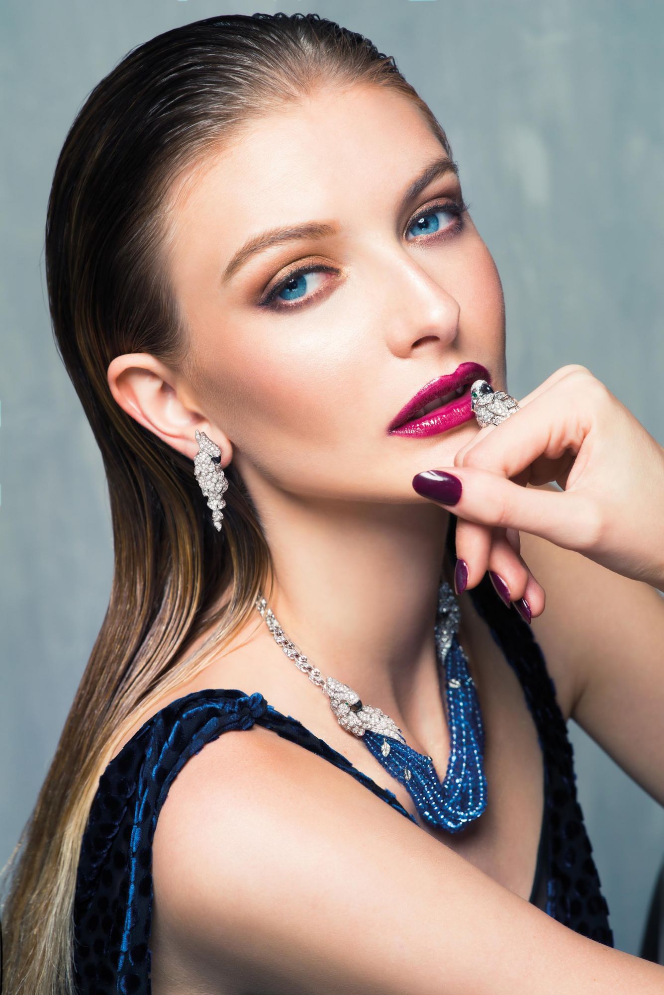 BIRDS OF PARADISE: Earrings, ring and necklace in white gold set with diamonds, emeralds and mother-of-pearl by Cartier; dress by Diane von Furstenberg