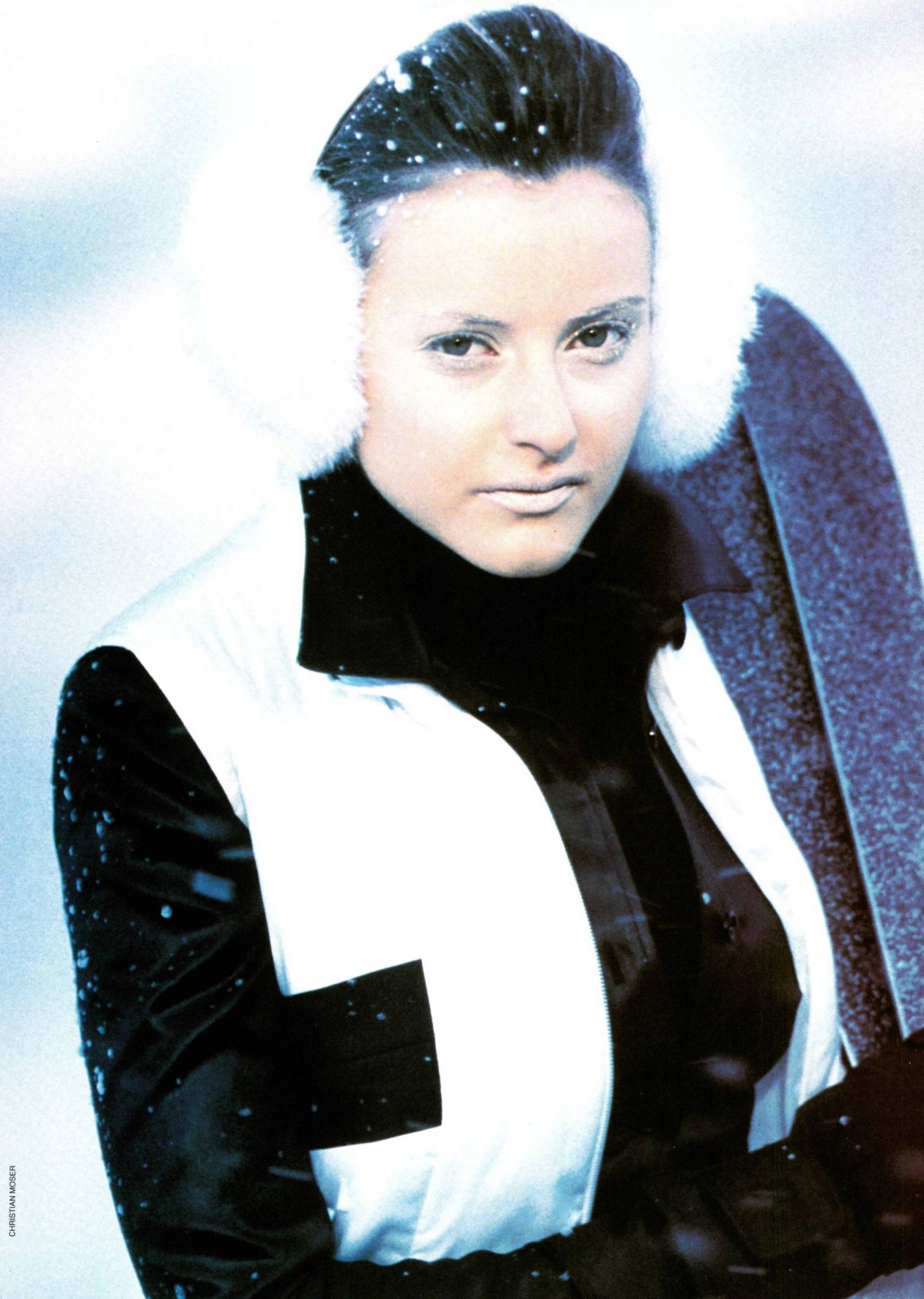 Quilted jacket and black lacquered satin shirt from Richard Voinnet. Ribbed roll-neck from Kookai, ski pants from V de V, ear muffs from Jacques Fath, mittens from Invite and skis from Dynastar
