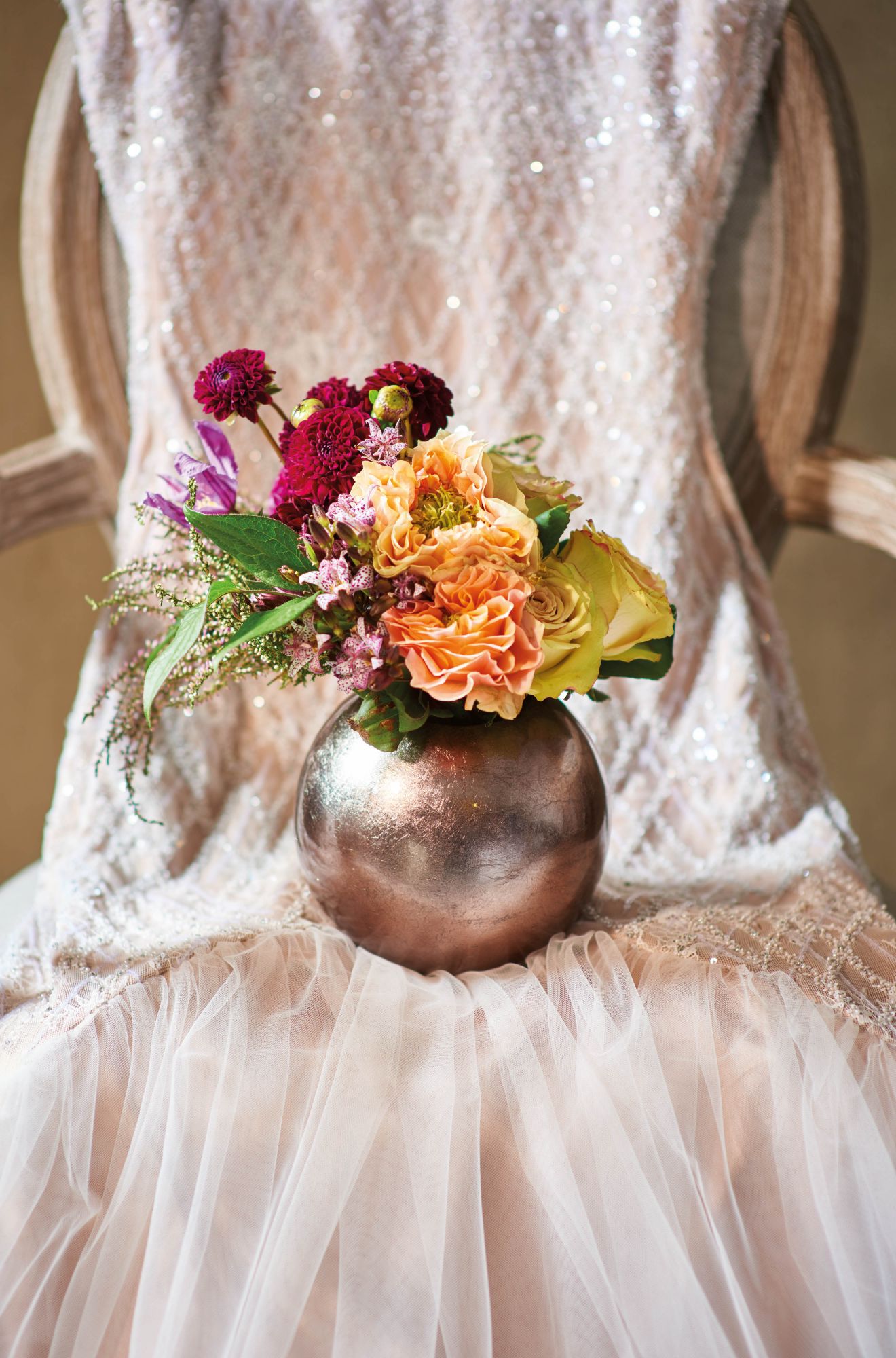 Bouquet of roses, dahlias and garden roses by Armani/Fiori; dress by Rania Hatoum; chair from Bowerbird Home