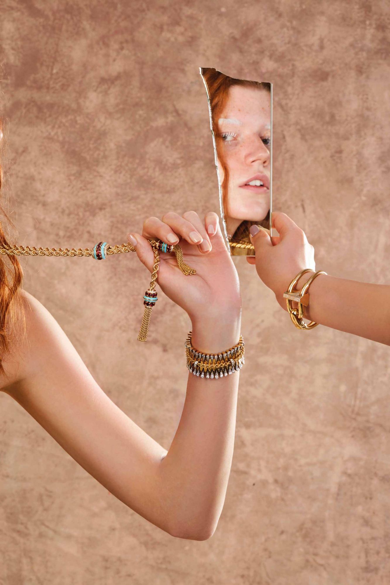 From left: Necklace in yellow gold with round diamonds, red spinels and turquoise by Liane | Heritage Collection bracelet in gold and platinum set with diamonds, from the by Jalousie Bateau | Cadenas Sertie bracelet watch in yellow gold set with diamonds and mother-of-pearl by Van Cleef & Arpels