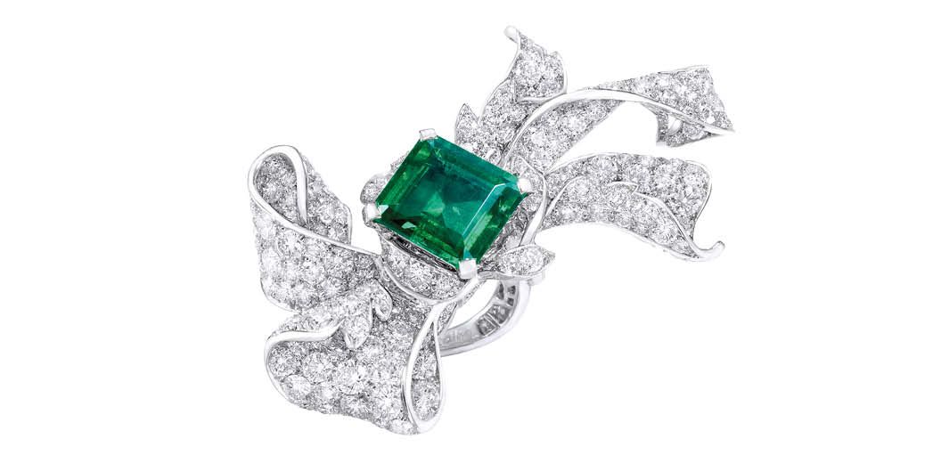 ANNA HU Pétales d’Amour ring in white gold set with a 5.4-carat emerald and diamonds. Available at Anna Hu