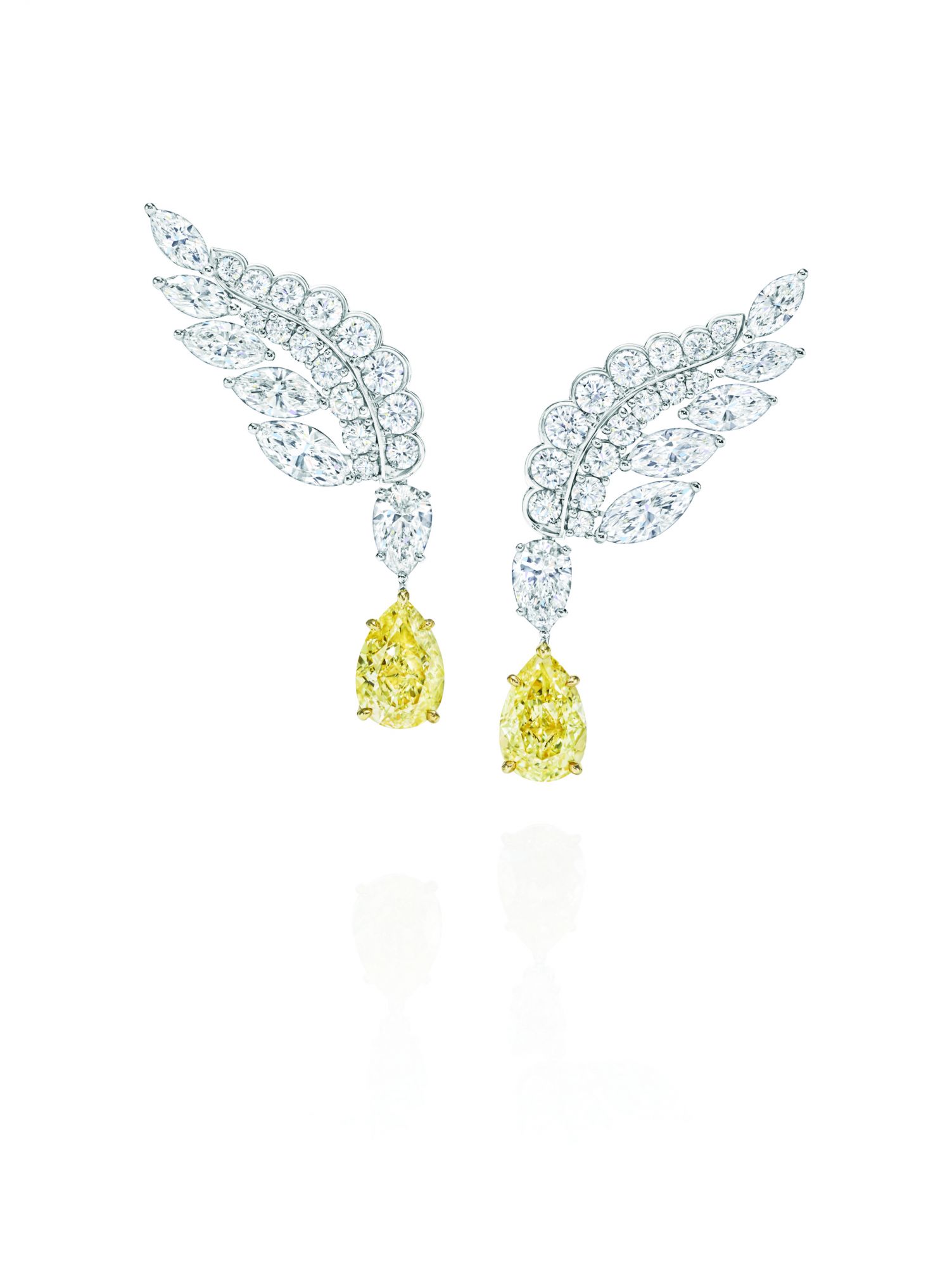Eagle earrings in platinum set with yellow sapphires and white diamonds, by Harry Winston