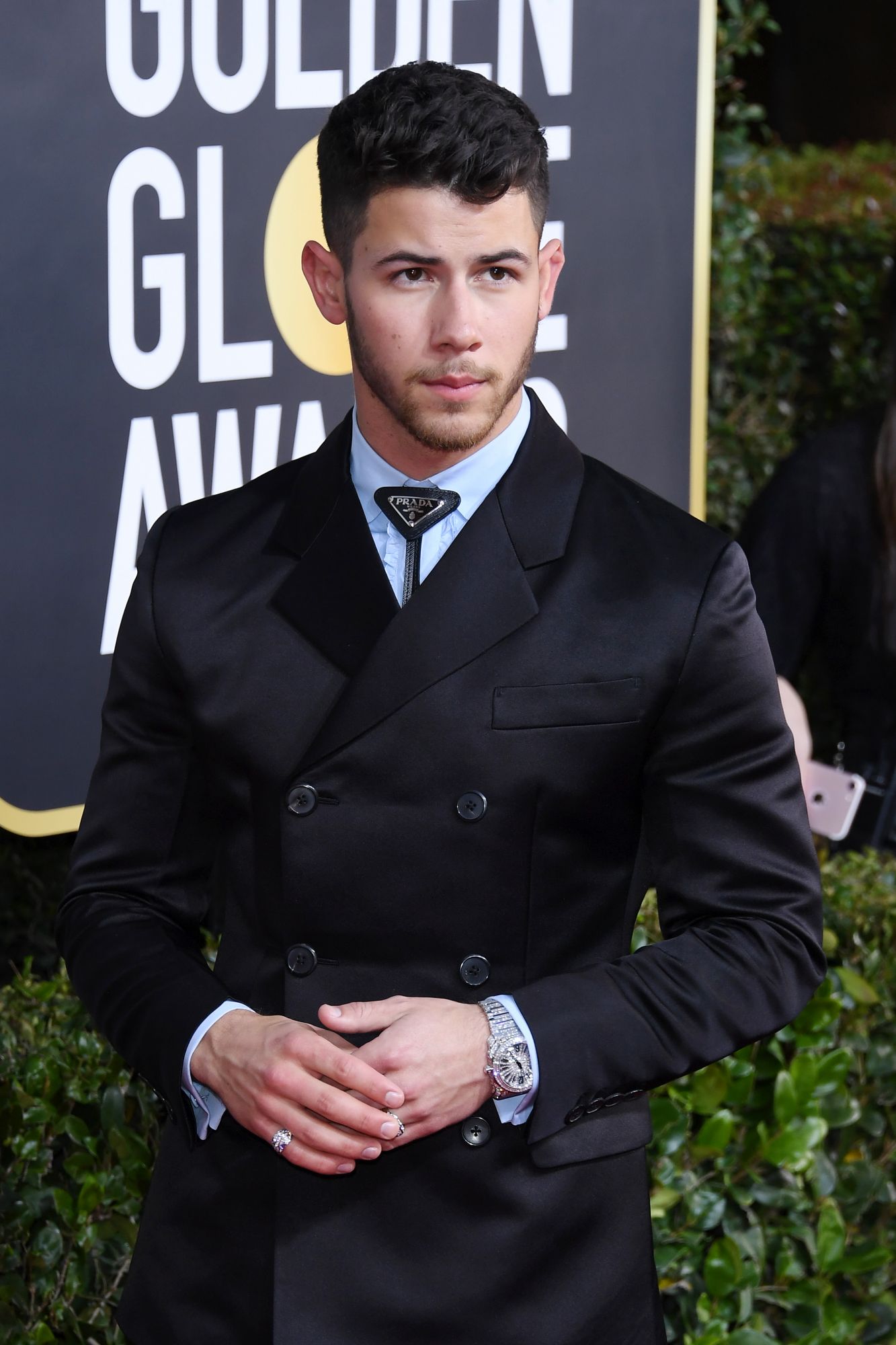 Nick Jonas paired his Octo diamond watch, which features 50.25 carats (valued at over US$1 million) with Serpenti rings set with sapphires and tanzanites, all by Bulgari