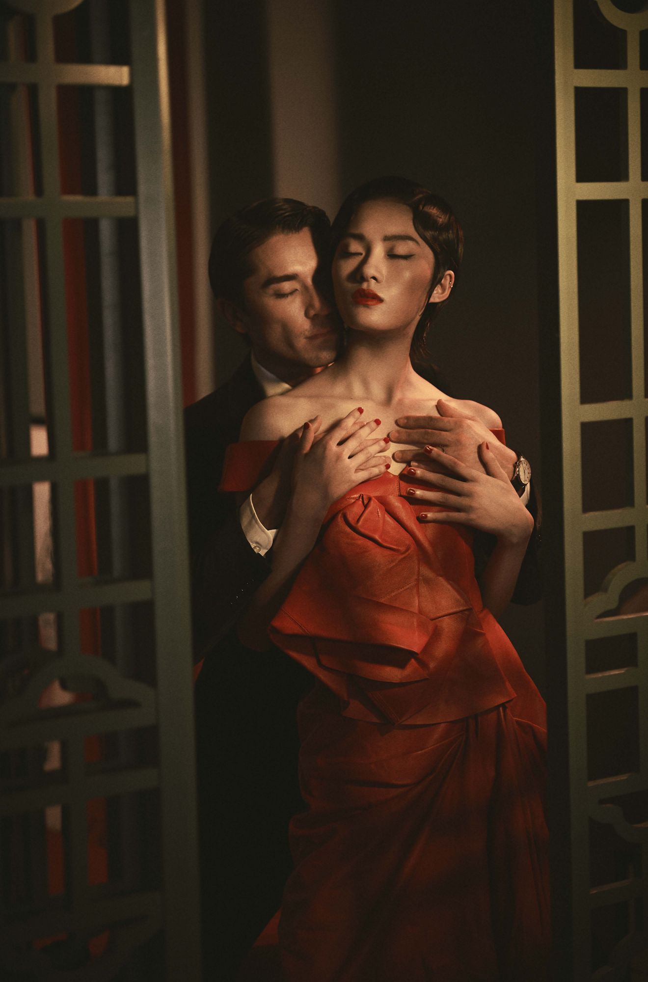Le Si wears a dress by Alexander McQueen; Kenta wears a shirt and jacket by Tom Ford