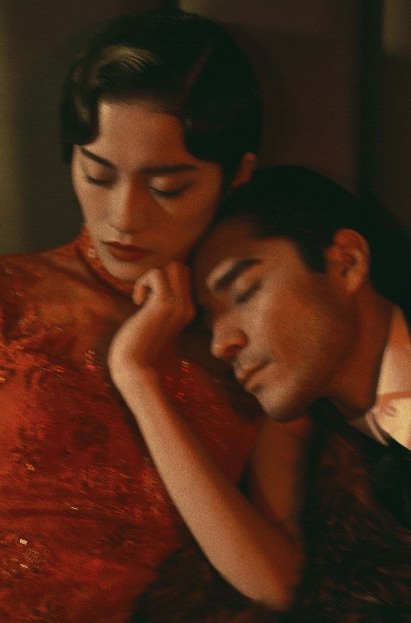 Le Si wears a qipao by Jos; Kenta wears a shirt and jacket by Tom Ford
