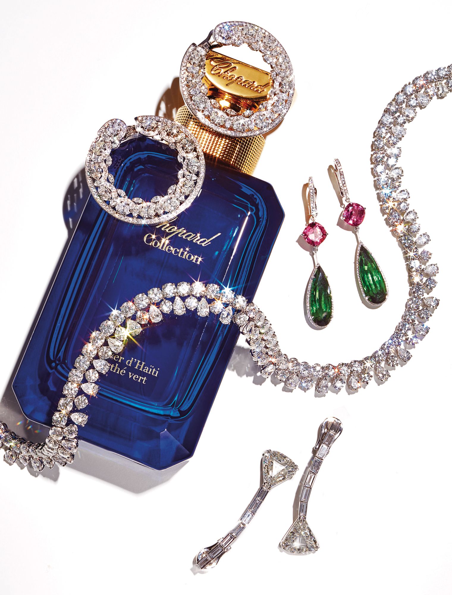 Precious Lace earrings in white gold and titanium set with diamonds; Temptations earrings in white gold set with green and pink tourmalines and diamonds; necklace in white gold set with diamonds; Solitaire earrings in white gold set with diamonds. Vétiver d’Haïti au Thé Vert perfume, all by Chopard