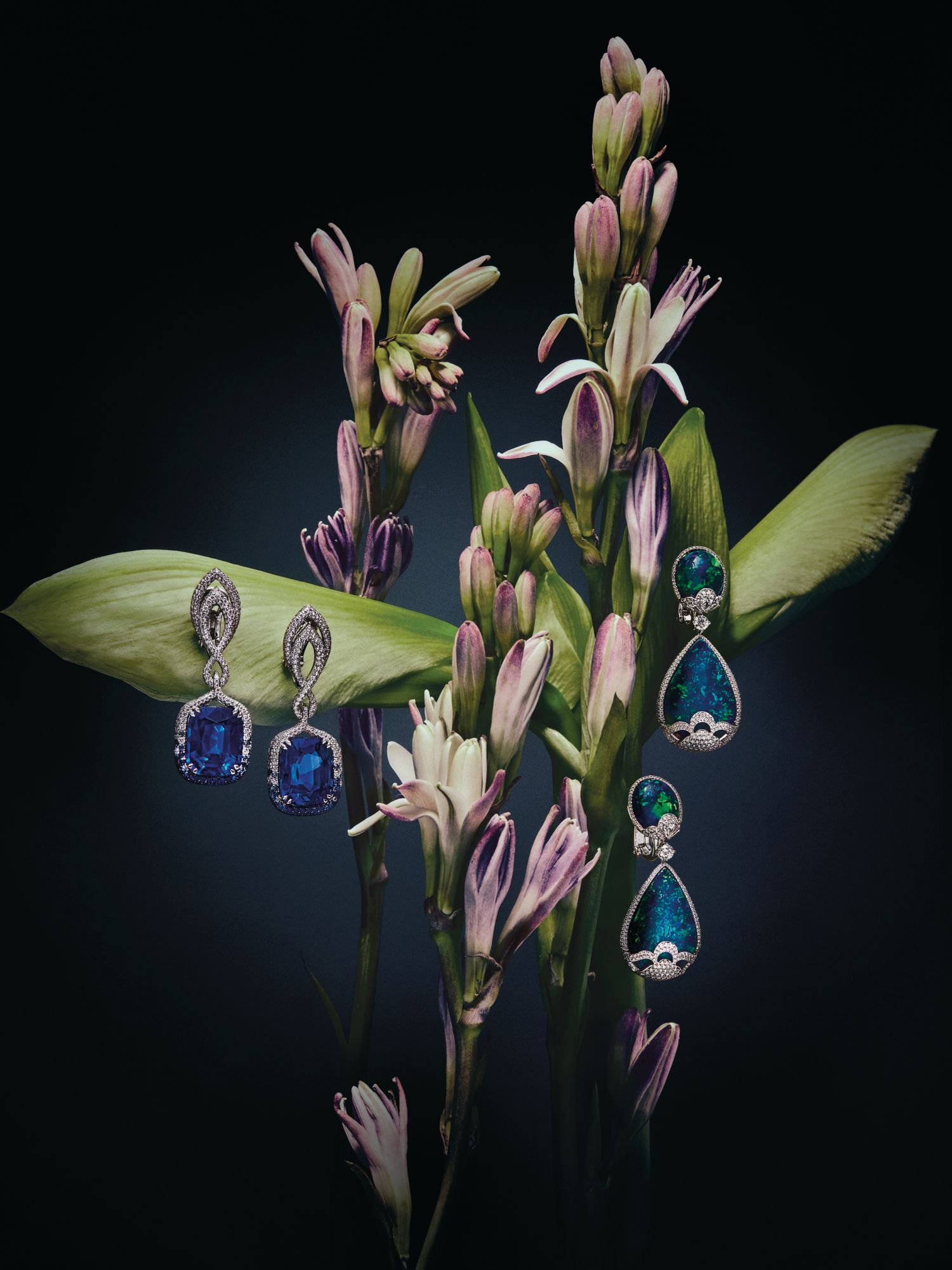 Earrings in white gold set with sapphires and diamonds; earrings in white gold set with opals and diamonds, both by Chopard