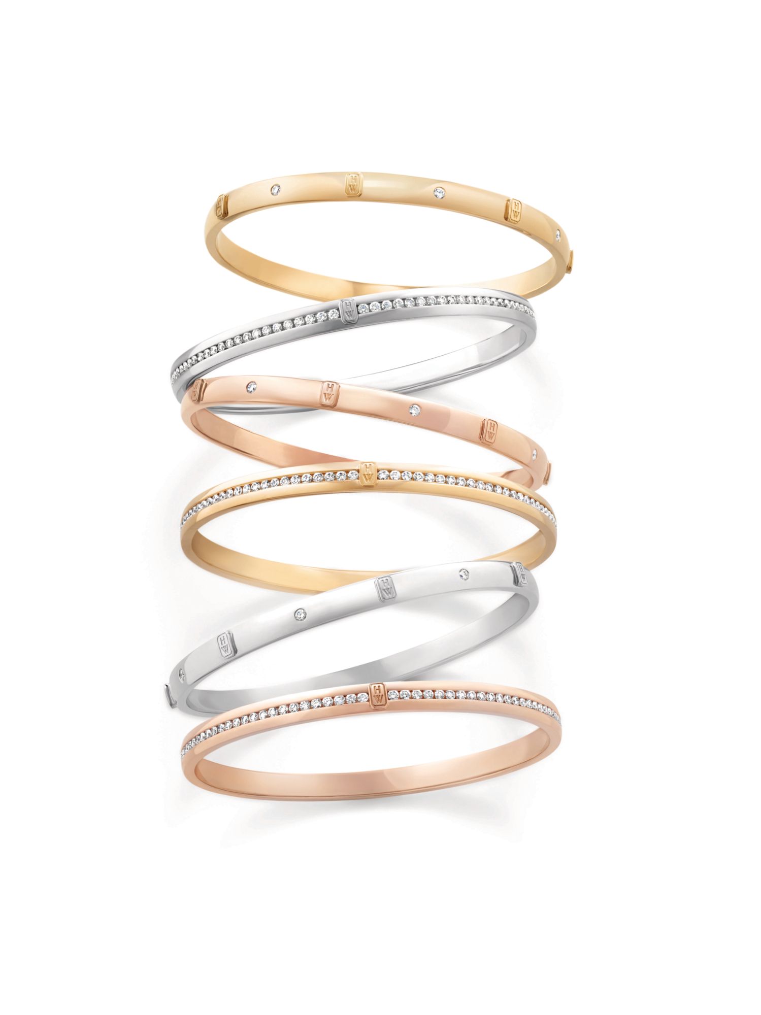 Harry Winston HW Logo bangles in yellow, rose and white gold set with diamonds.