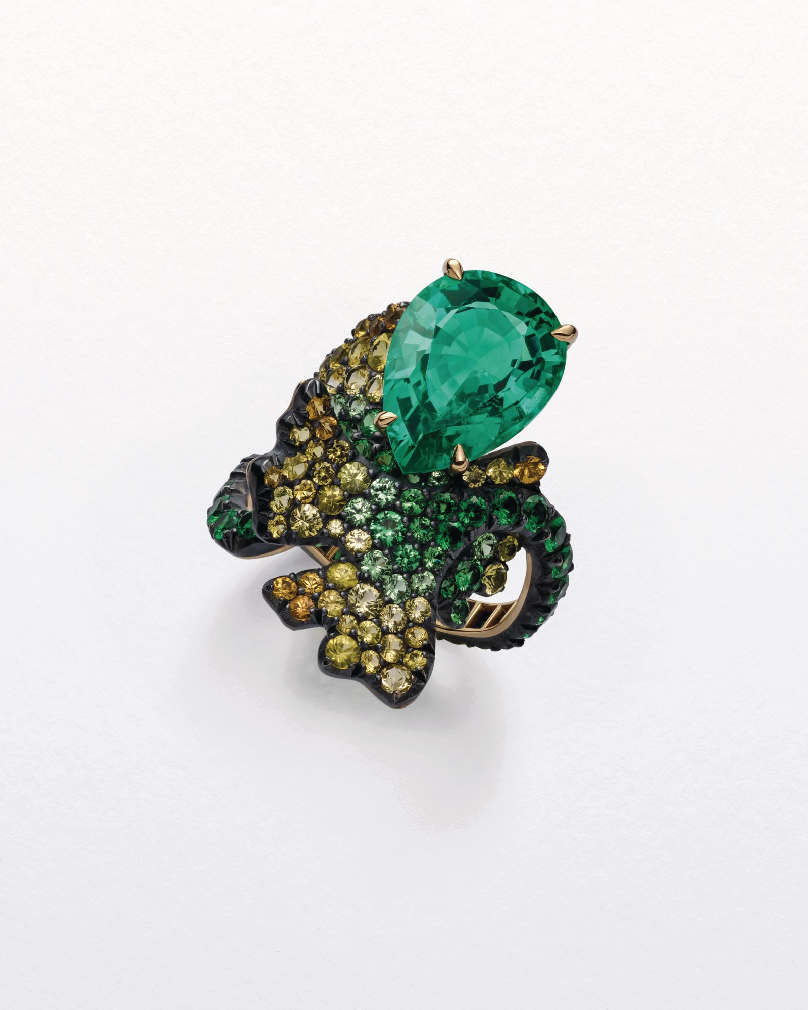 Gingko ring in rose gold and titanium set with emeralds, yellow sapphires and tsavorites by Chopard