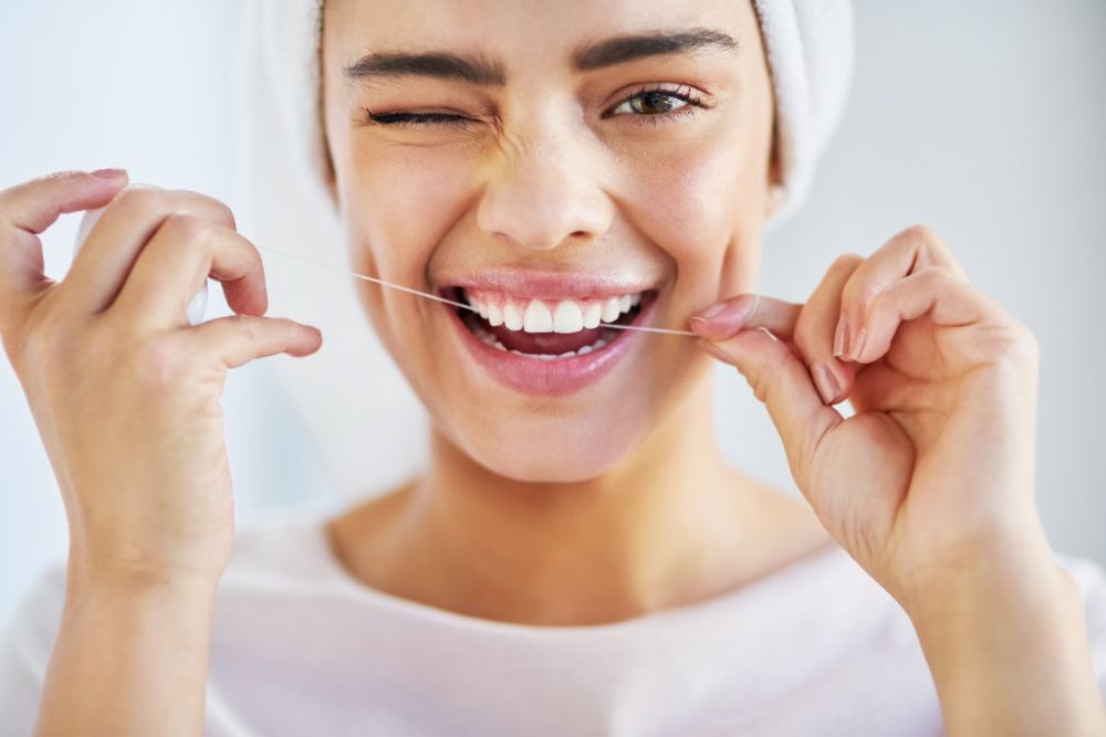 How to build good habits, like flossing, into your daily routine (photo: Getty Images)