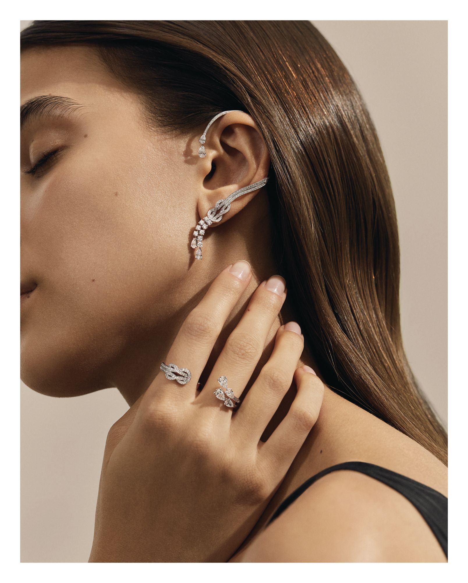 Chance Infinie ear cuff and double ring in white gold set with diamonds, both by Fred