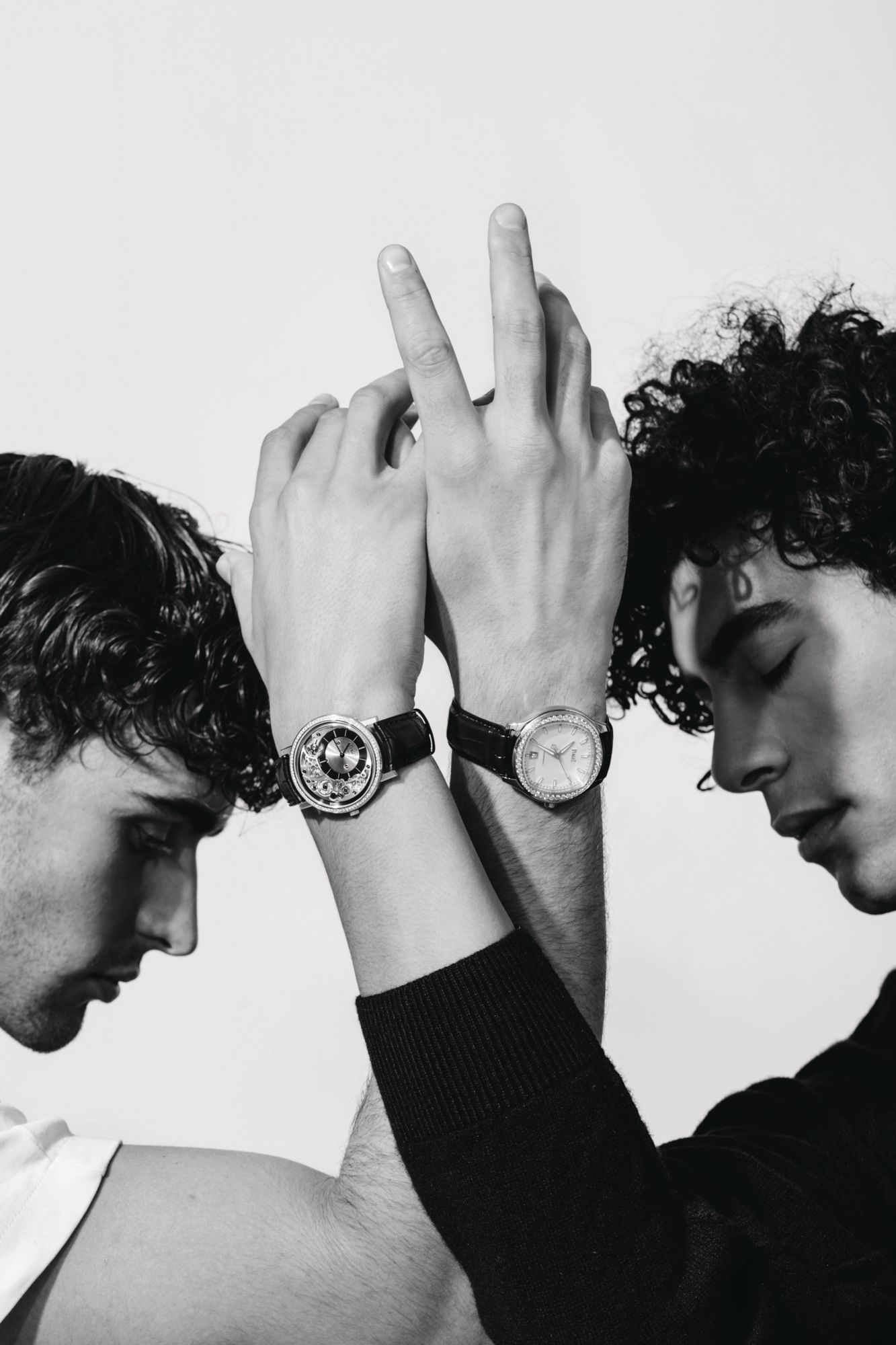 Altiplano Ultimate Automatic watch, Polo watch, both by Piaget. Model's own shirt, Louis Vuitton top