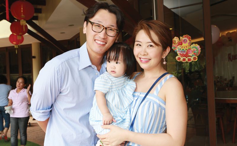 Proud parents Tan Shen Wain and Lim Ai San with birthday girl Tan Rue Mae.
