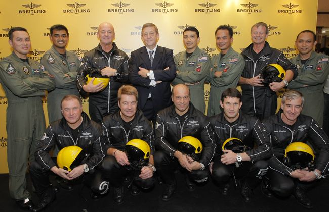 Royal Malaysian Airforce and Pilots of the Breitling Jet Team posing for the Breitling store opening