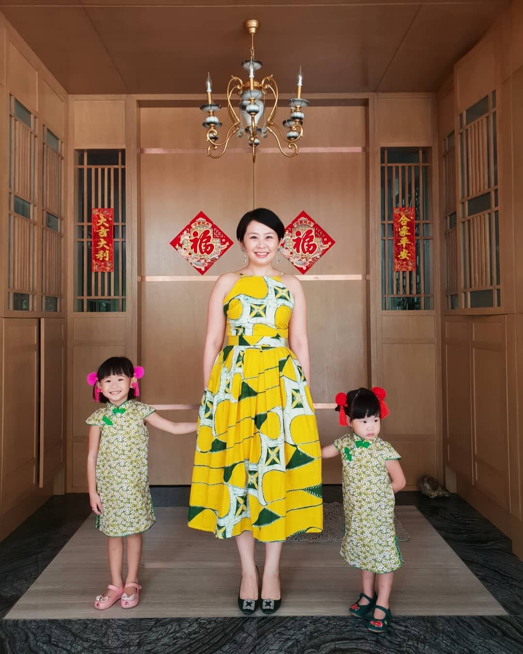 Lim Ai San & her daughters couldn't wait to snap their festive #OOTD from Tjantingkoe and Bops&Pops. (Photo: @aisanlim/Instagram)