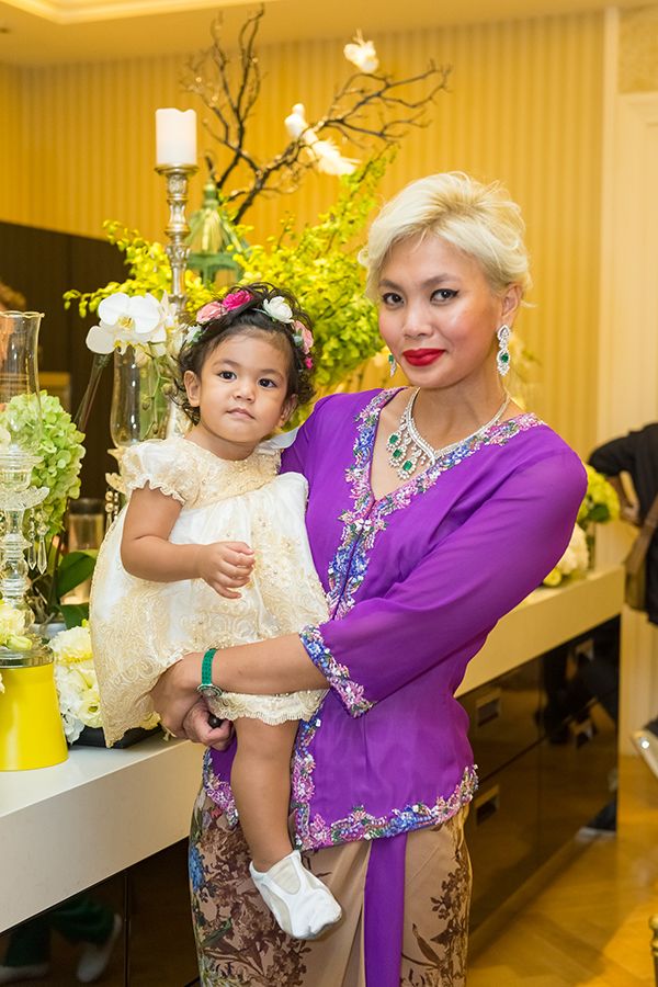 2016 March: Living up to her fashion finesse even while on mummy duty, Esha maintains a polished picture with a royal purple kebaya at the KL wedding of sister Amira Geneid to Cameron Priest
