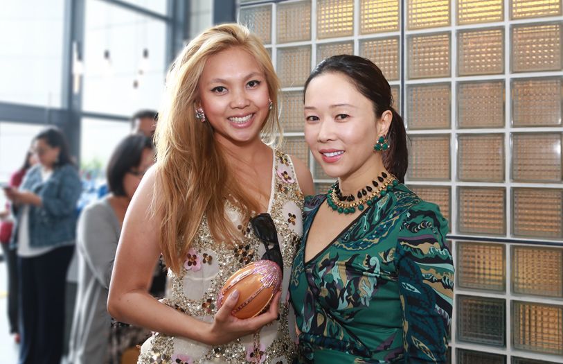 2014 November: Esha's choice outfit for a girly afternoon is in an embroidered dress and egg clutch, at a Judith Leiber soiree with Shawna Yap