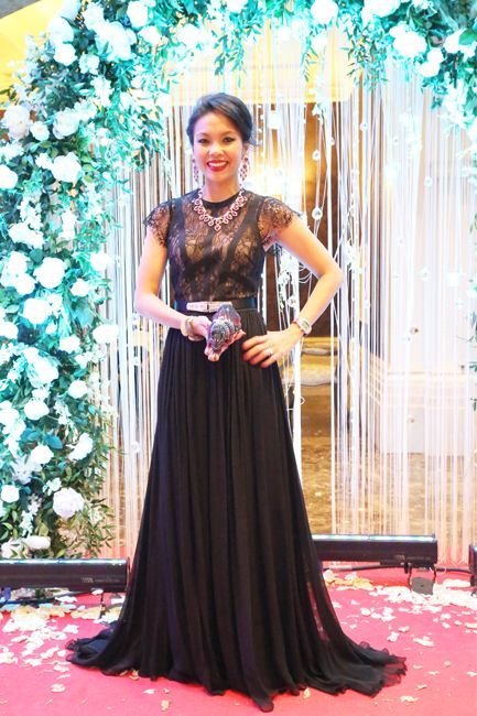 2013 June: Dressed in a lace dress with sequinned statement clutch, at the wedding reception of Alia Geneid and Dias Atamkulov in Kazakhstan