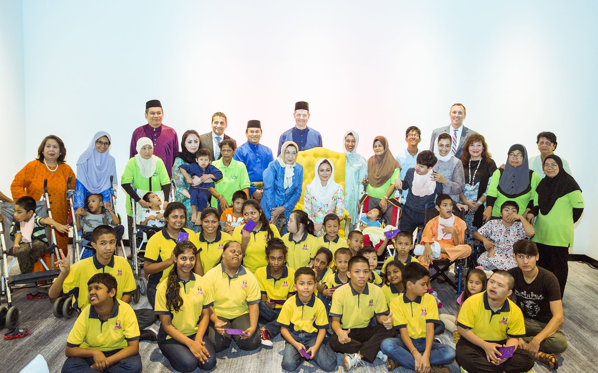 Tengku Permaisuri Norashikin with the children from Tasputra Perkim and Taman Megah children's home