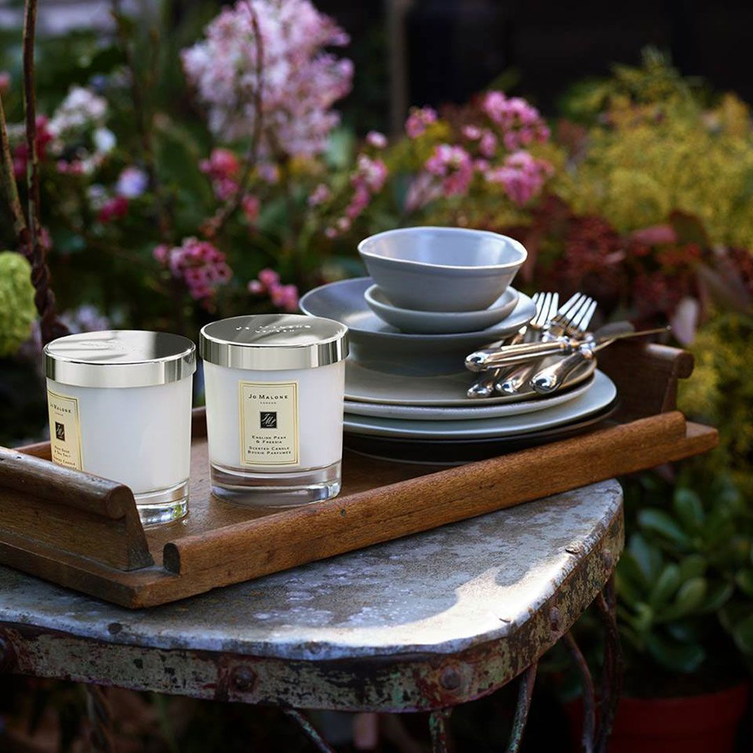 Relaxing and inviting is the effect you'll achieve with Jo Malone London's deluxe candles in rich scents of Wood Sage & Sea Salt, Sweet Almond & Macaron and more: browse through their home collection for a candle or two to light on a rainy day. (Photo: Courtesy of Jo Malone London)