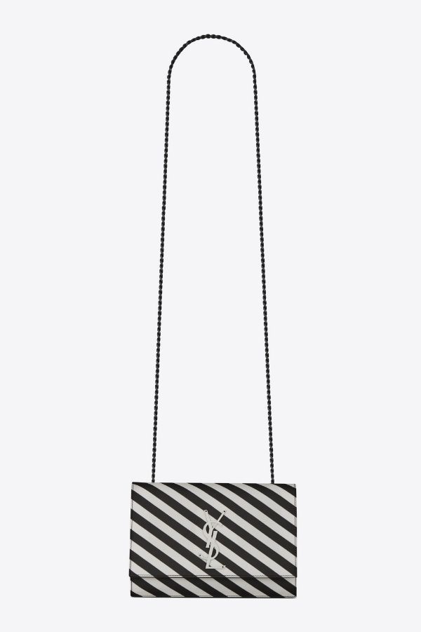 Minimalistic stripes hint at the impactful Sixties fashion. (Photo credit: Yves Saint Laurent)