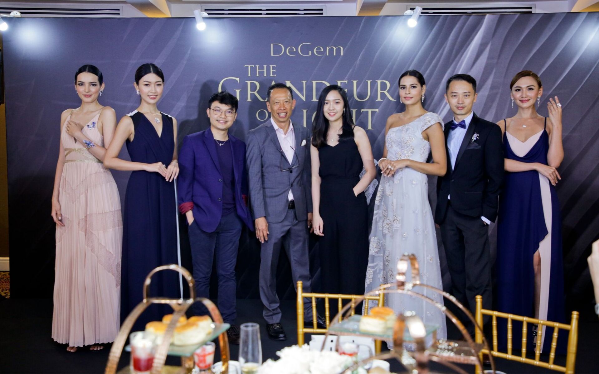 Freedome Choong, Stephen Choong, Leong Su Ling and Yew Yong Hee posing with DeGem models