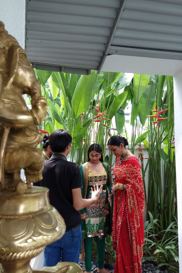 Then came Datin' Sri Mary's turn to show off her fiery-red saree for the camera, posing with daughter Thanyakumari in their garden.