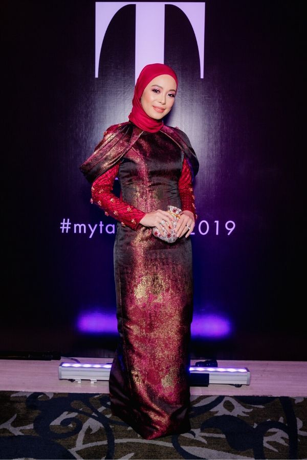 Datin Vivy Yusof turned heads in an armour-like dress by Innai Red with a studded purse by Judith Leiber