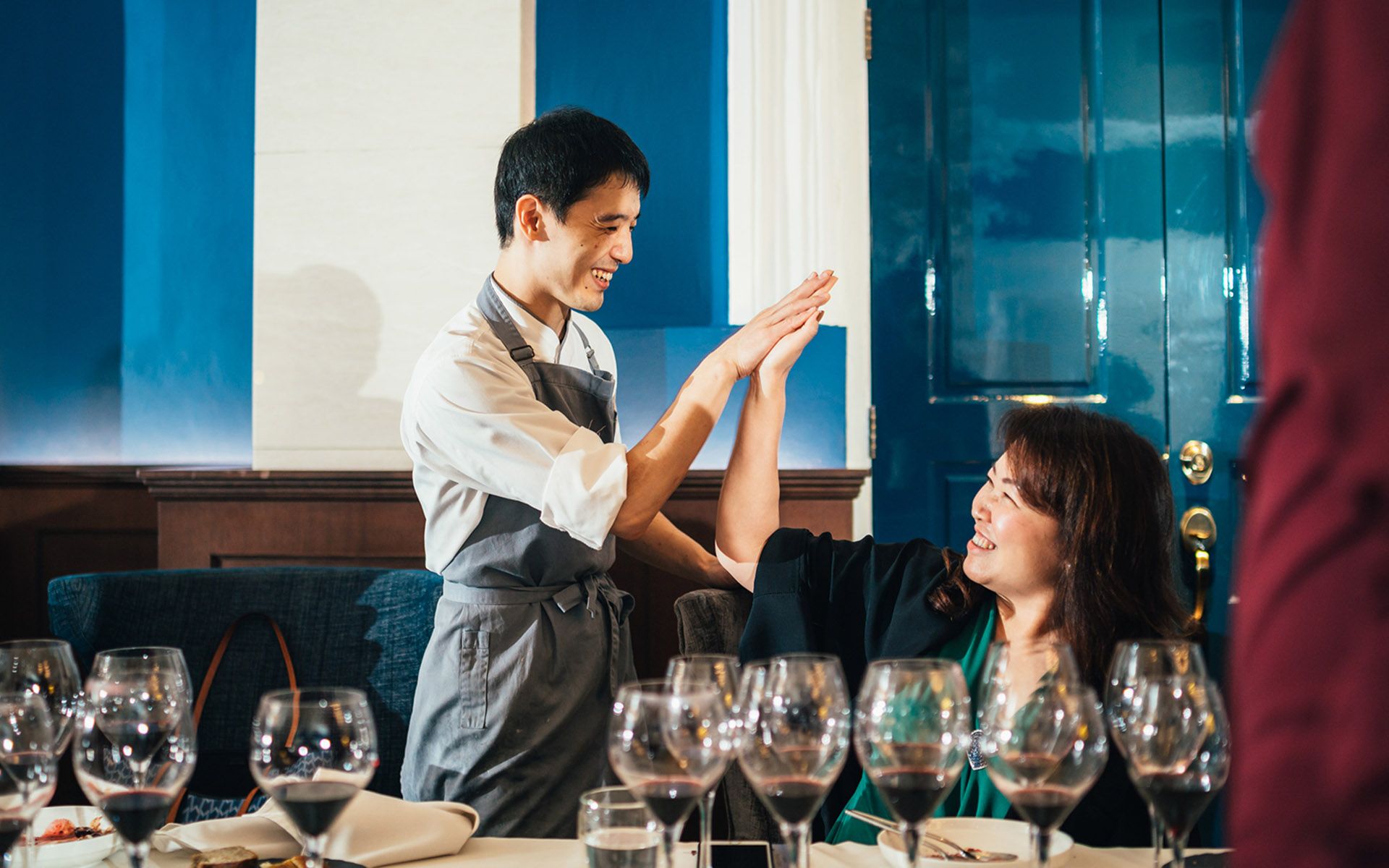 Chef Takuya and Datin Karen H’ng giving each other a high-five over the success of the wine dinner