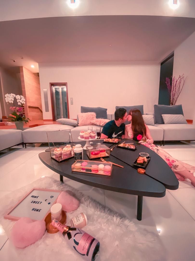 Christening their first home with a bottle of champagne and a kiss for Valentine's Day are lovebirds Melissa Lim and Tan San Ming. (Photo: @melissamaelyn/Instagram)