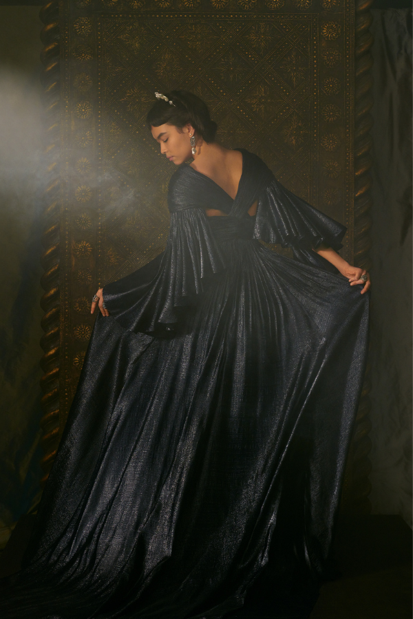 L'Étoile: Long draped, twisted dress in navy silk lamé