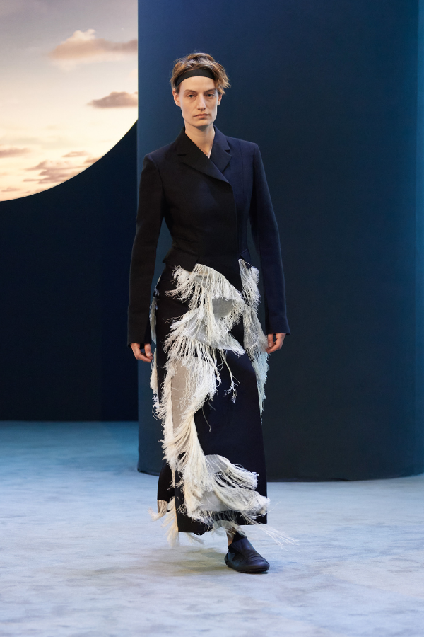 Combining function and form: the headband adds an air of practicality to the fringed overcoat