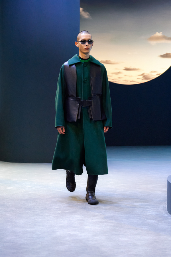 The thin shades and leather vest sells the futuristic space cowboy vibe in this collection