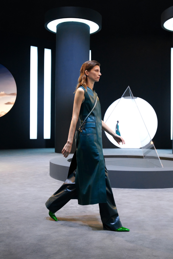 Flared trousers add a feminine element to this utilitarian, uniform look