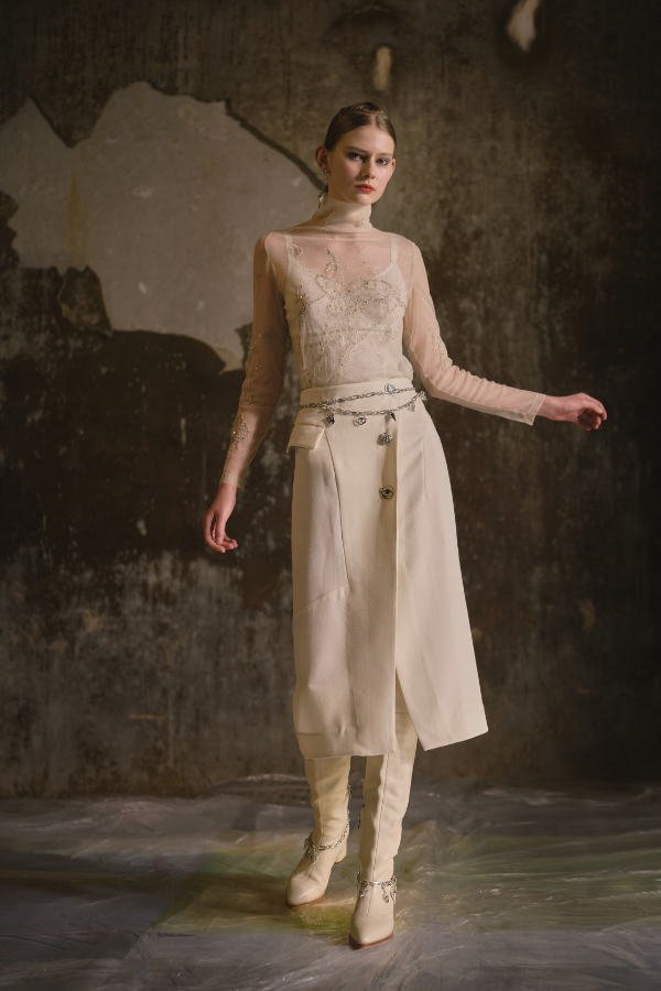 Lace corset paired with vest and sheer net yarn top with embroidery