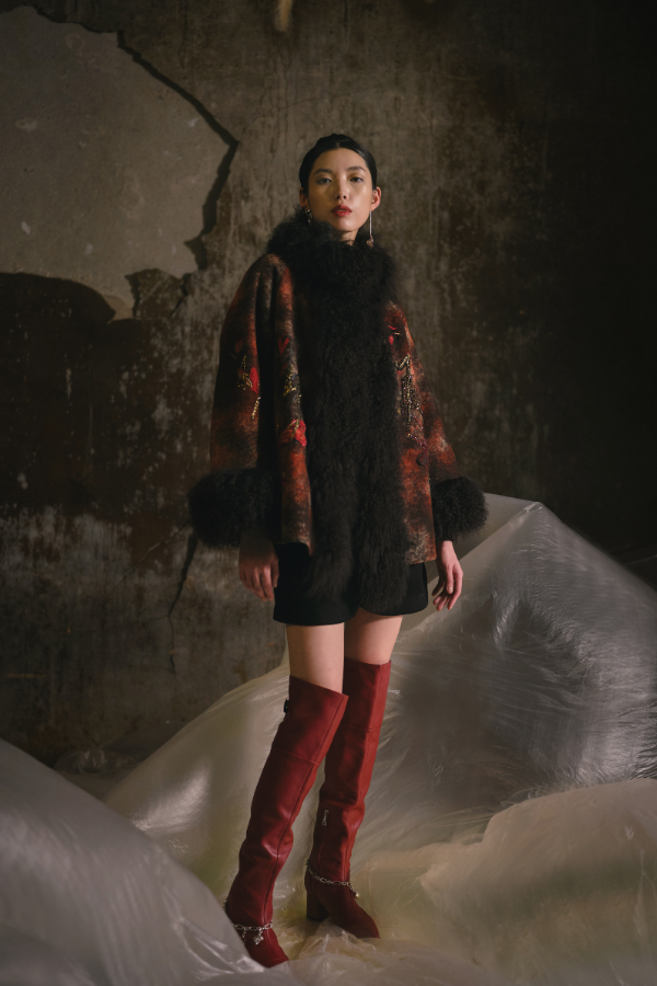 Chinese craft techniques come to the forefront with this gorgeous coat with fur trimmings