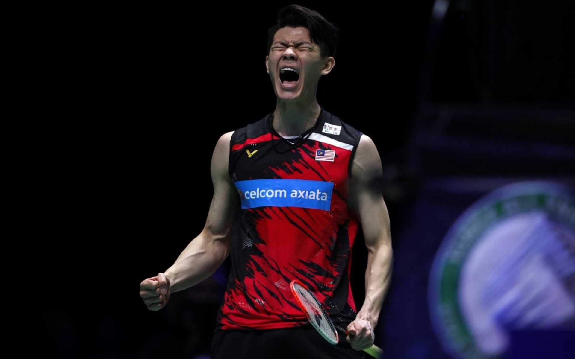 Malaysia's Lee Zii Jia celebrates winning a point after a long rally against Denmark's Viktor Axelsen during the men's singles final on the last day of the All England Open Badminton Championship at the Utilita Arena in Birmingham, central England, on March 21, 2021. (Photo by Adrian DENNIS / AFP)