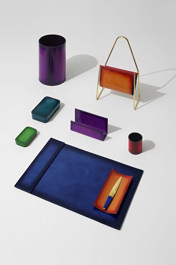 Merging hand-stitched Venezia calf leather and cast brass, the Berluti Objects collection boasts a desk blotter, a letter opener, a magazine rack and stationery holders that pop with colour and charm (Photo: Berluti)