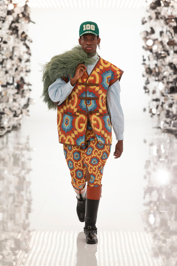 Modern tailoring and bold prints are topped off with an eclectic range of accessories, from the riding boots to the green baseball cap