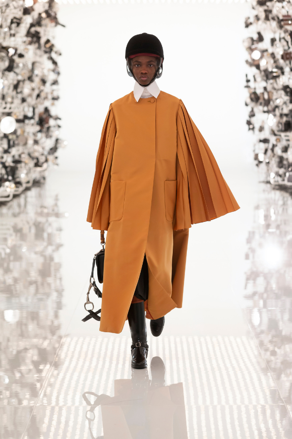 The classic oversized Balenciaga drape is refreshed with voluminous pleated sleves