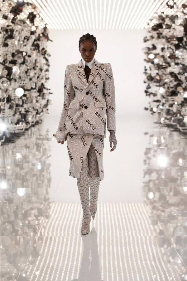 A show-stopping, sparkling suit emblazoned with two distinctive logo patterns that has gone viral on the internet