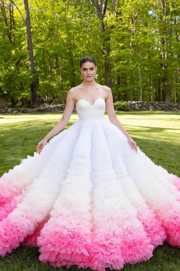 The pink ombré ruffles add a playful lightness to this full gown