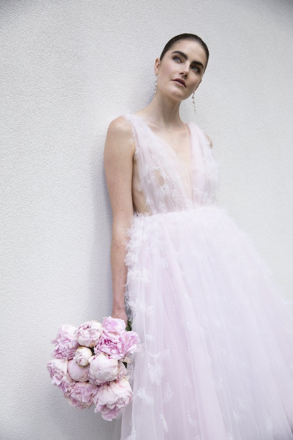 Romantic vintage: This light pink tulle wedding dress comes down right below the knees