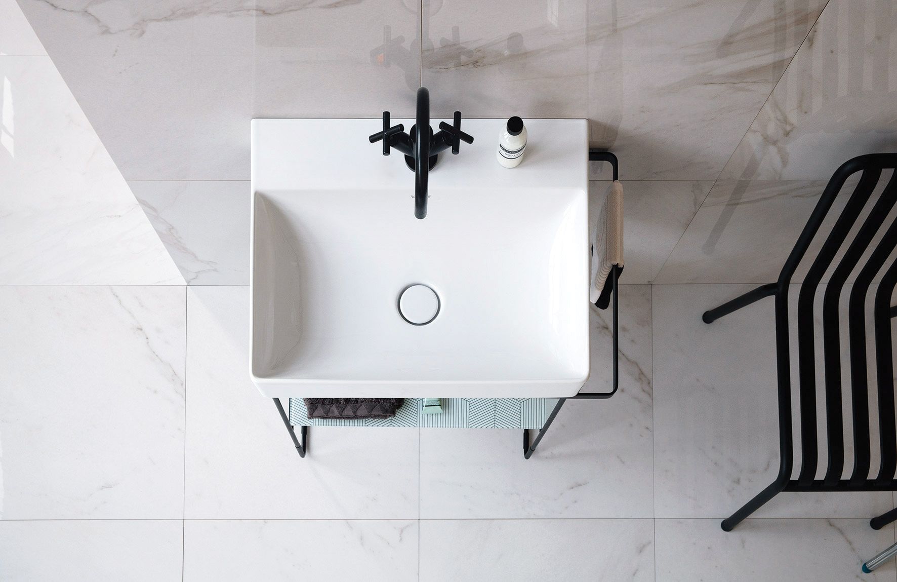 Sitting on an adjustable metal console, the DuraSquare washbasin exudes a functional modern aesthetic. Available at Duravit.