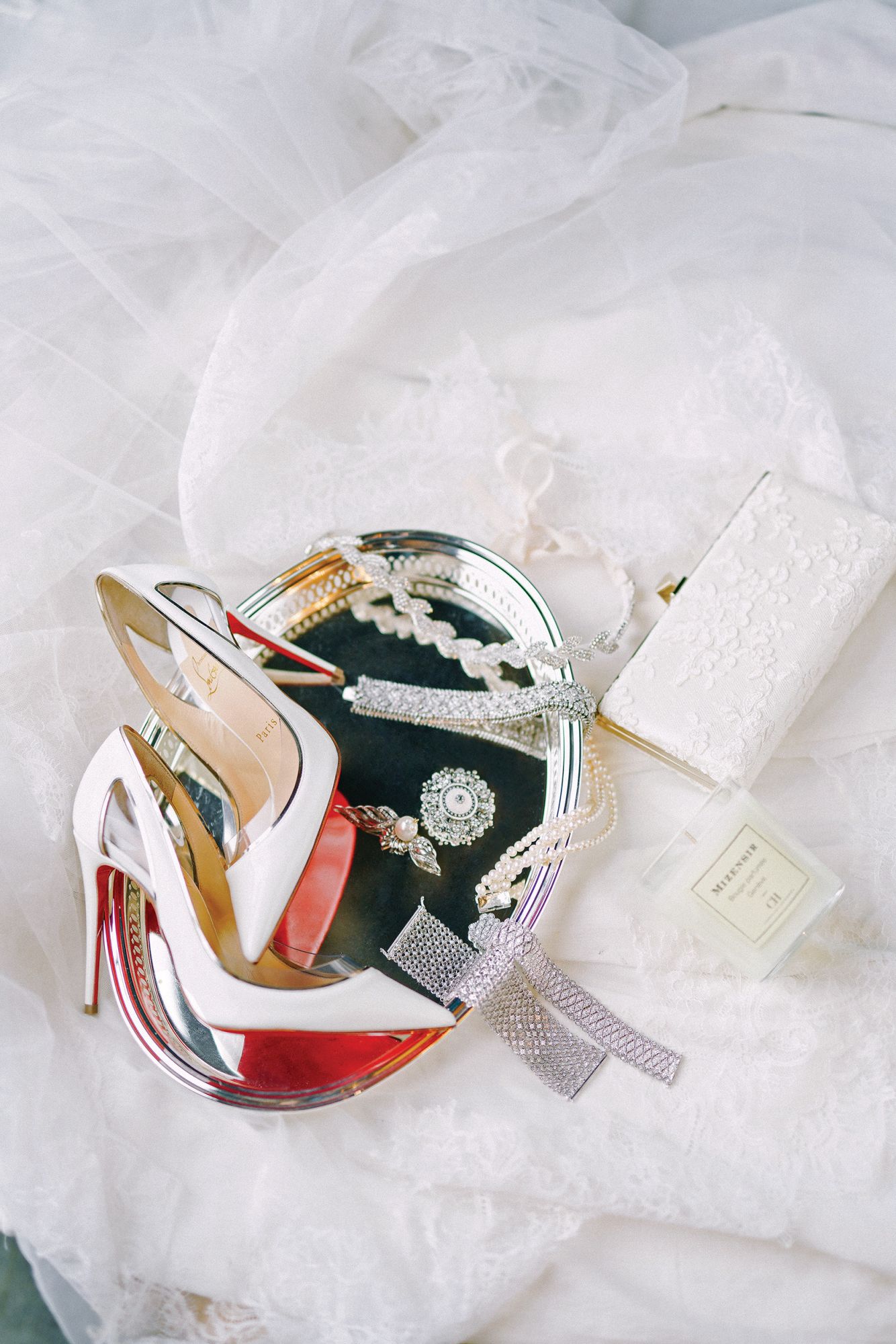Jimmy Choo lace clutch, CH by Carolina Herrera scented candle, diamond bracelets by Riqueza Jewellery, Christian Louboutin shoes from Rustan’s, Rosa Clara sequined belt, pearl and diamond choker by Riqueza Jewellery, hair pin and brooch by Nicole Whisenhunt