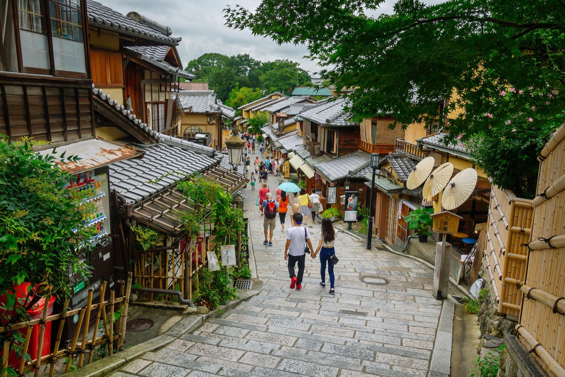 Kyoto, Japan - July 23, 2015: Tourists are enjoying on the Sannen-Zaka, Kyoto famous preserved street on July 21 2015 which located in the Gion district. Many souvenir shops can be found here.