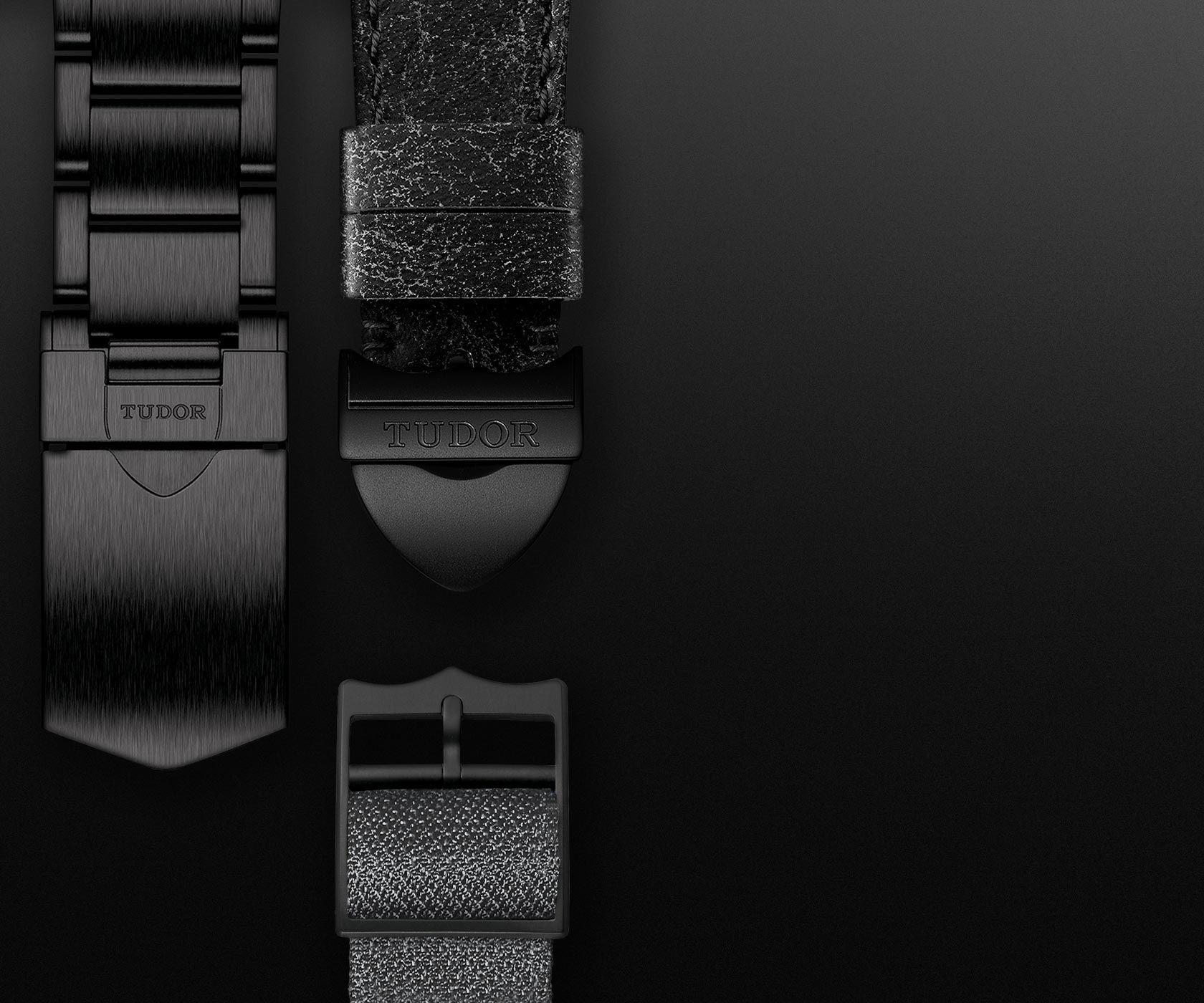 Satin-brushed steel bracelet with a black PVD coating and black rubber strap
